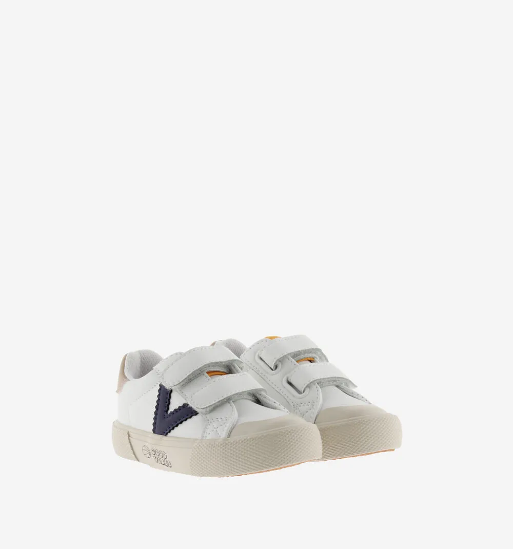 White leather sneaker with navy "V"